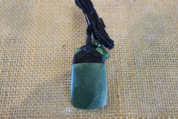 Toki Carved Jade Pendant